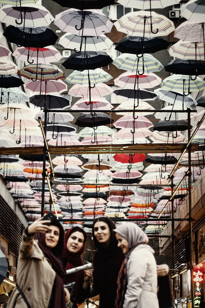 A roof made by umbrellas