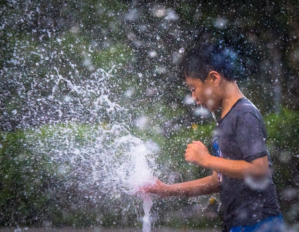 playing with water fountain