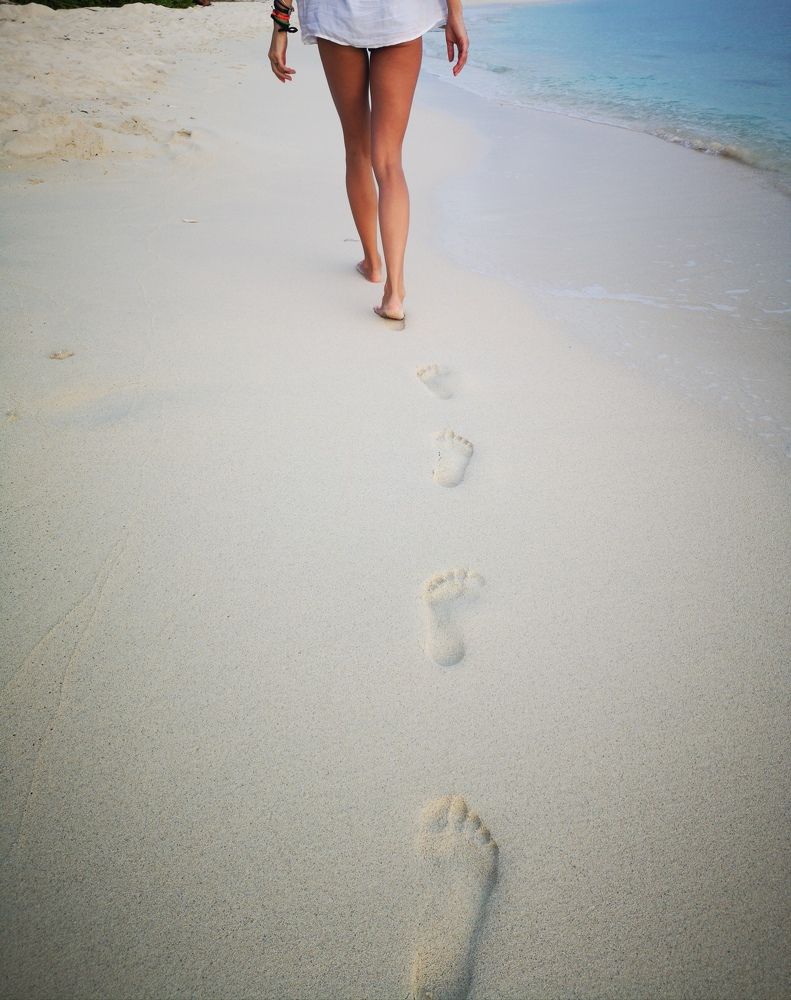 Foot steps in the sand