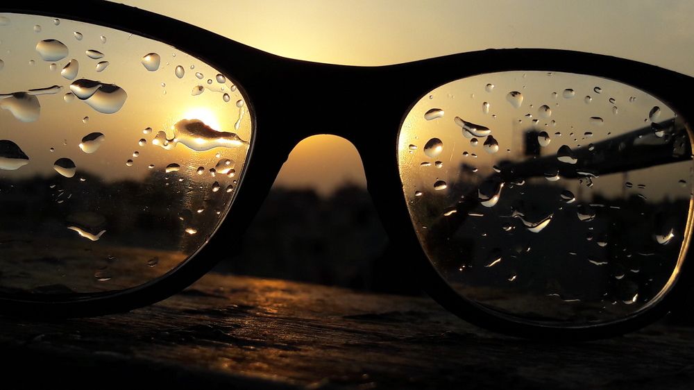 Sunset water drop on spectacles
