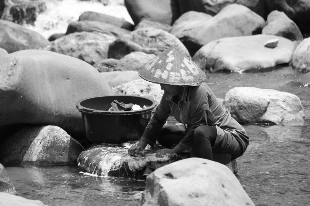 washing clothes on the river