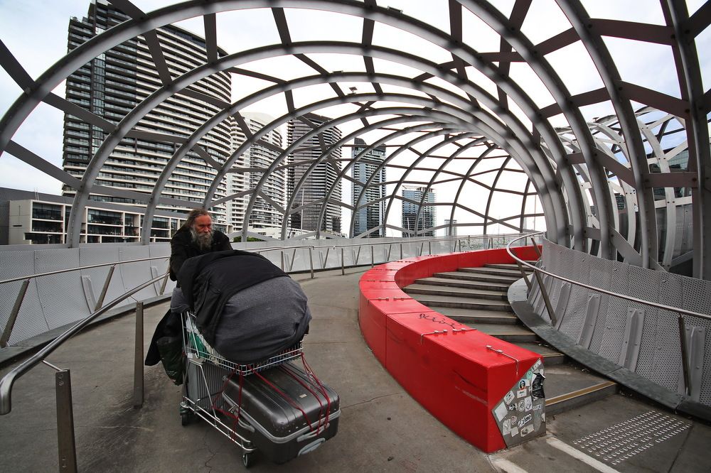 The beggar is on the bridge