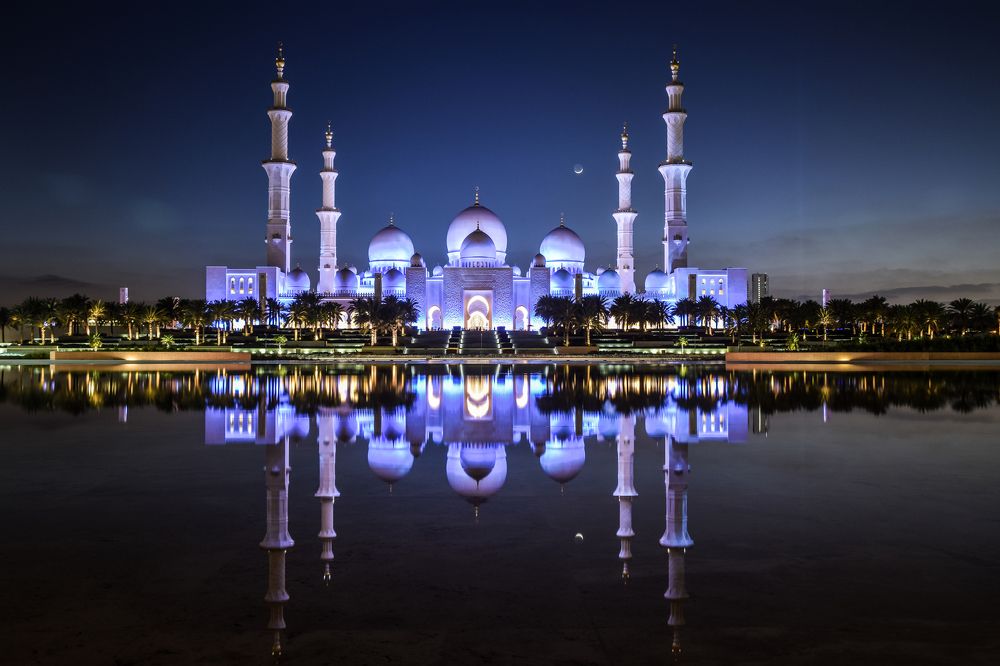 Mosque with reflection of natural water.