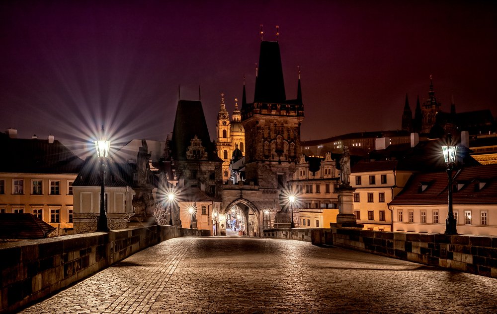 Famous Charles Bridge in Prague at sunrise.