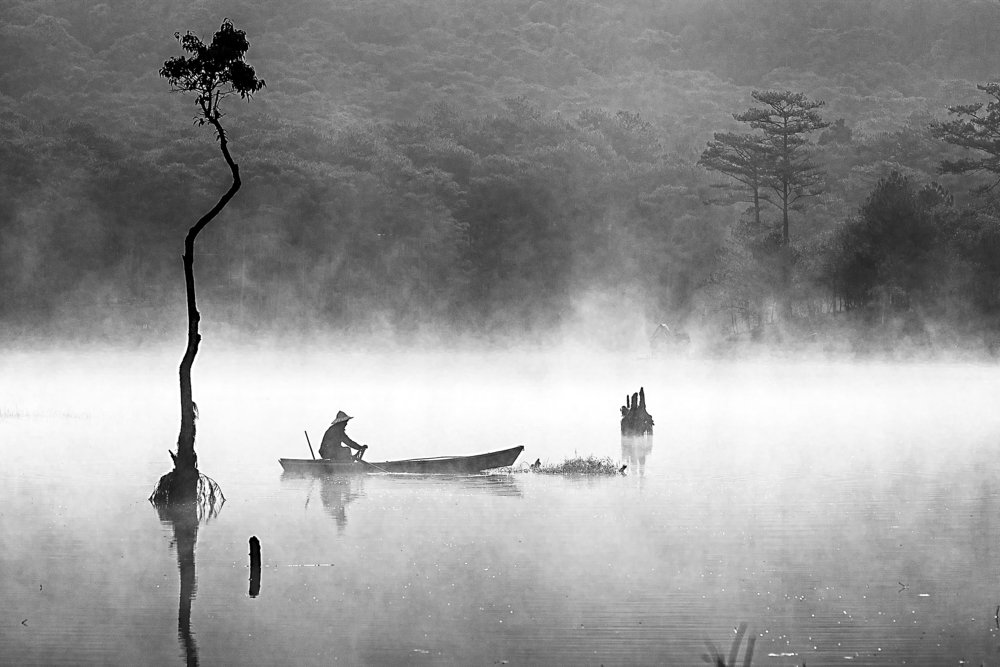 Fisherman on the lake miss