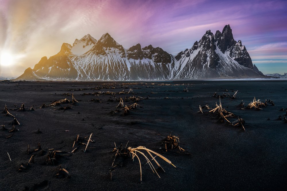 Sun peaking through the mountain