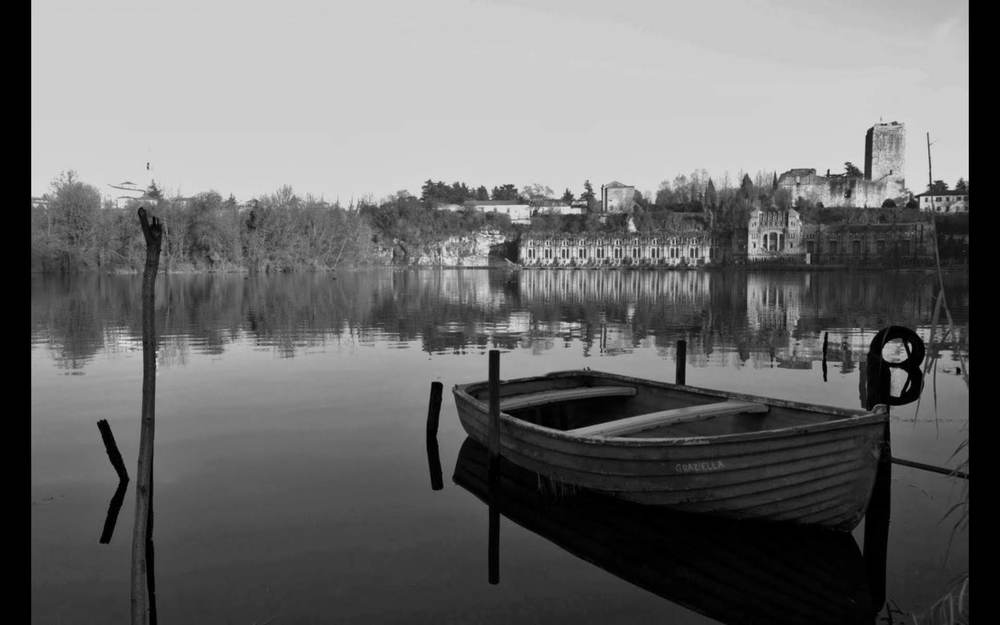 old power plant and a boat