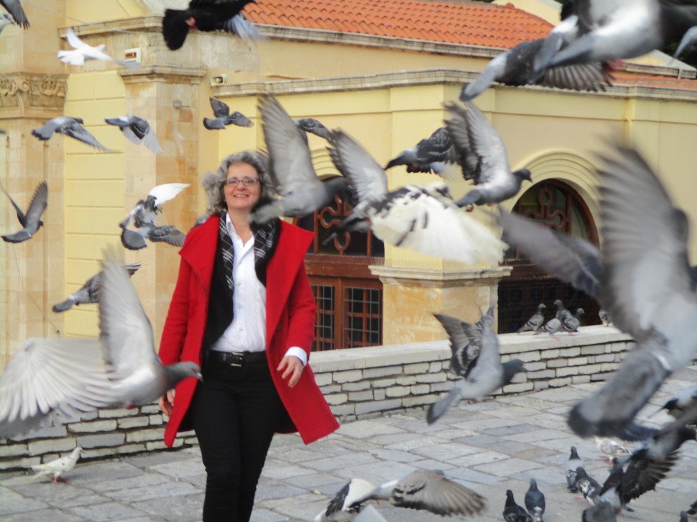 Woman with pigeons
