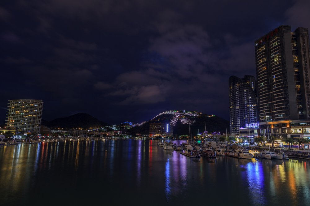 Night panorama of Sanya city, view from the bridge to the bay