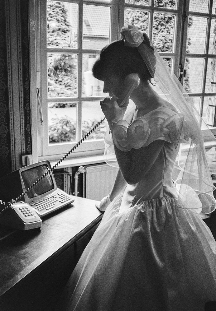 French bride talking to the phone
