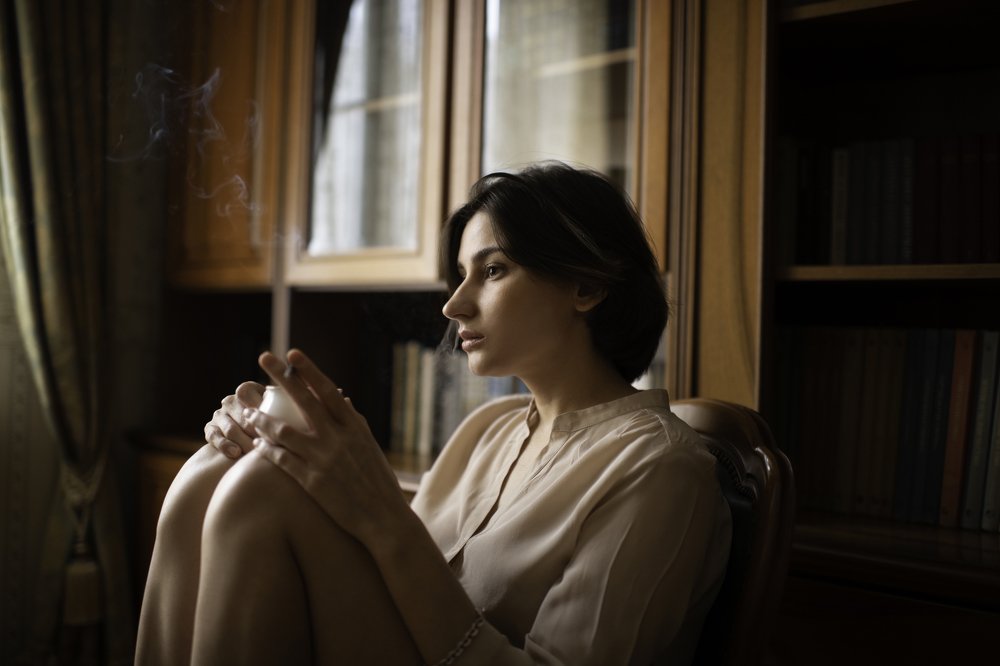 Woman with cigarette and coffee