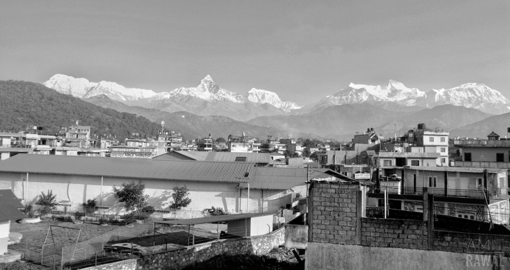 Black and white landscape of a city.