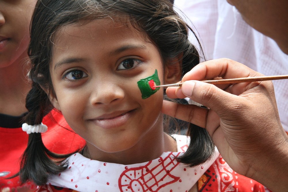 A kids painting  in a traditional cultural program