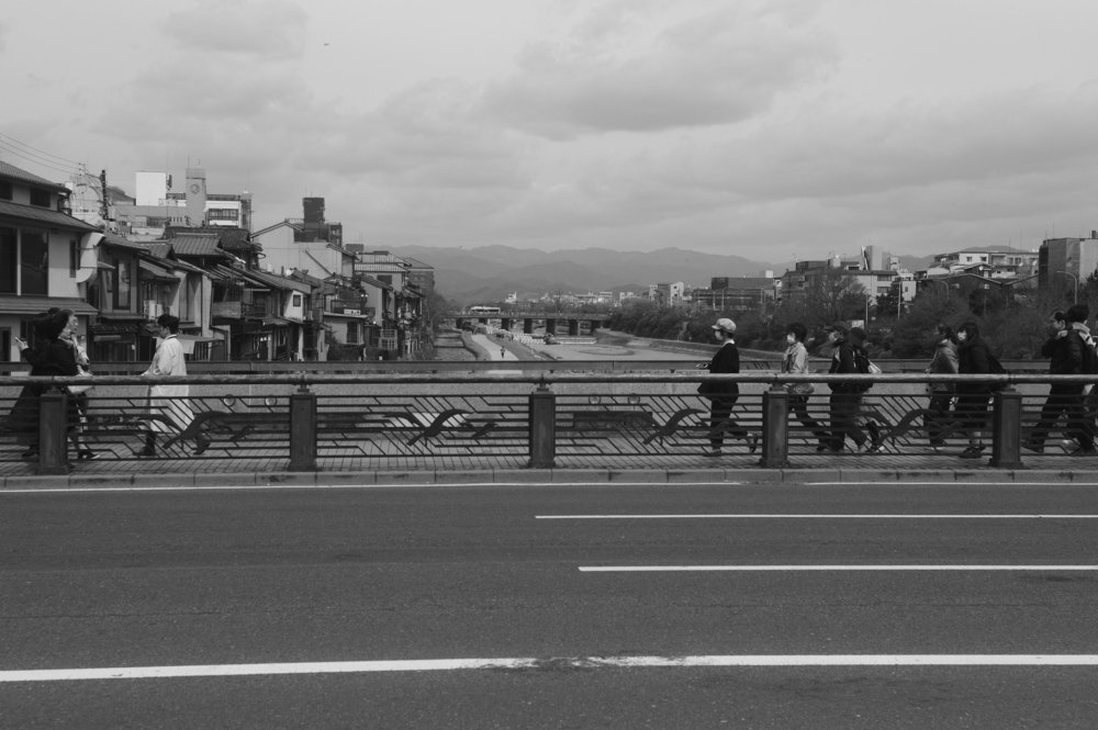 People walk on the bridge