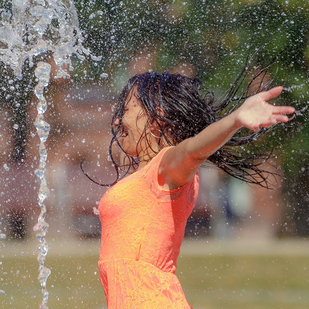 Woman and water fountain