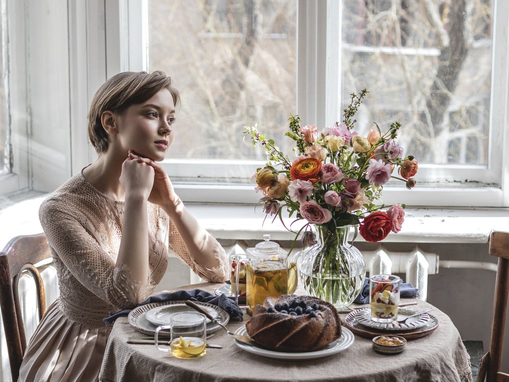 Dreamy girl at breakfast