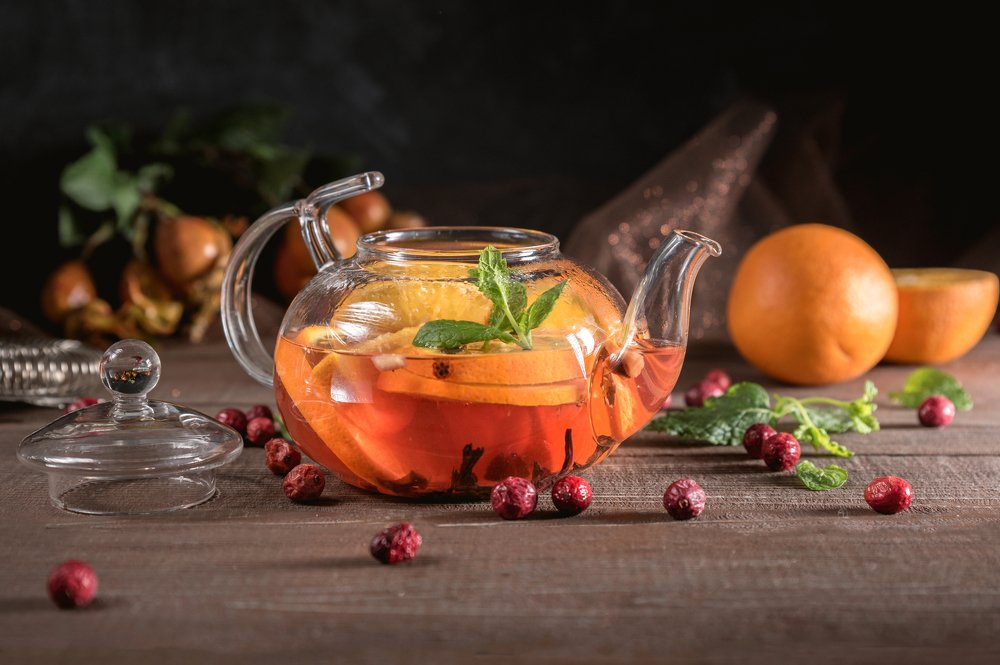 Hot herbal tea with oranges and mint