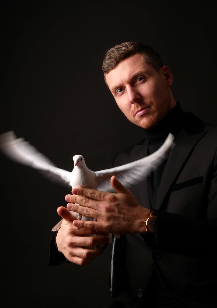 magician with white dove