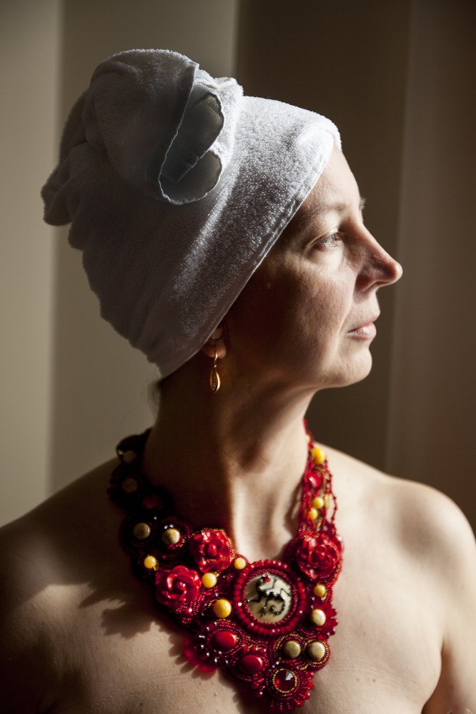 Woman with red jewelery