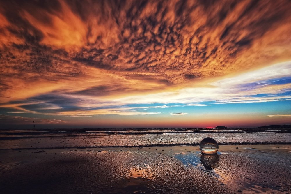 Dramatic sunset clouds with lens ball