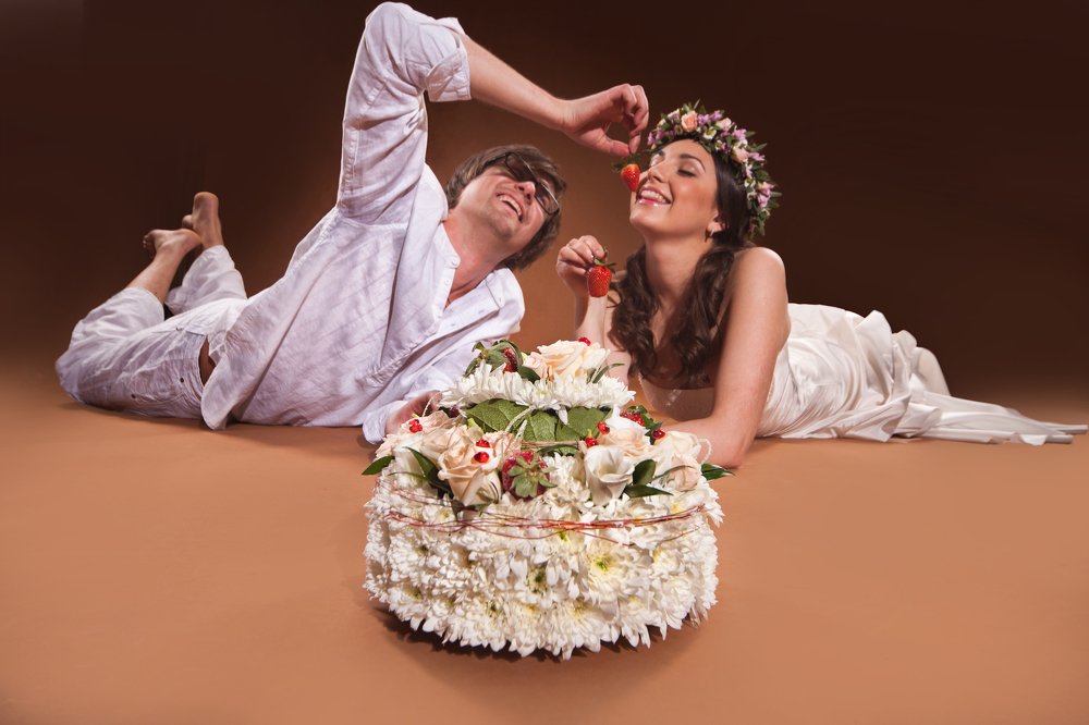 Young Couple And Flower Cake