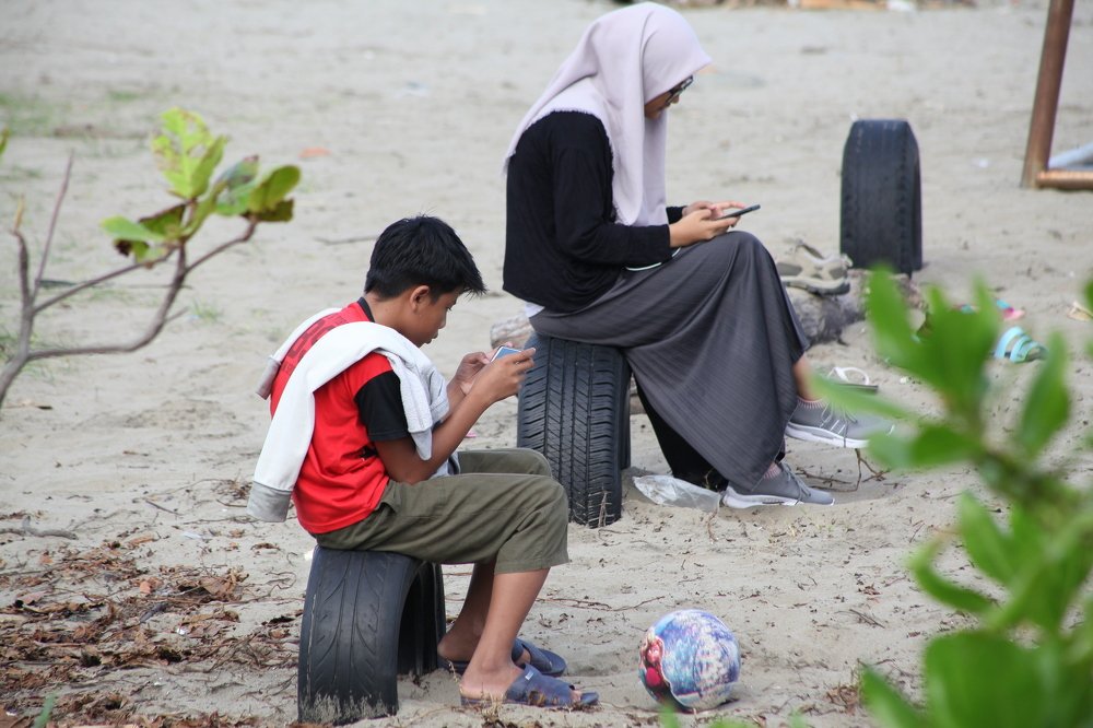 busy playing sophisticated cellphones