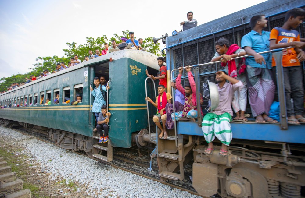 Undefined people live on top and train engine way to home meet family