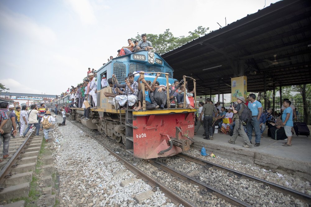 Undefined people live on top and train engine way to home meet family