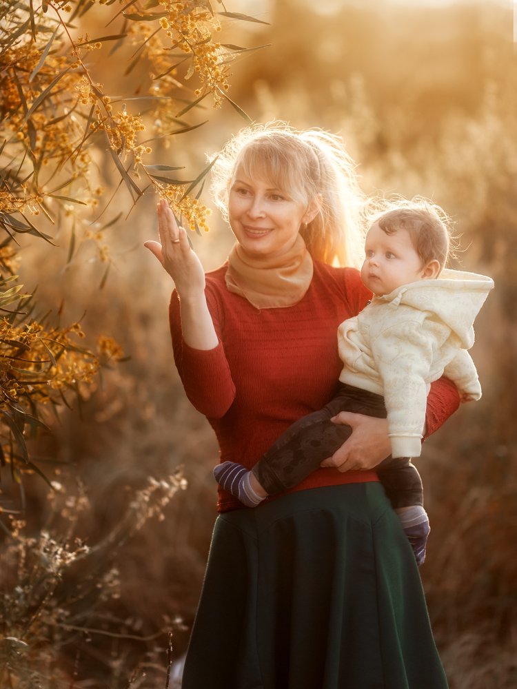Mother holding her baby son
