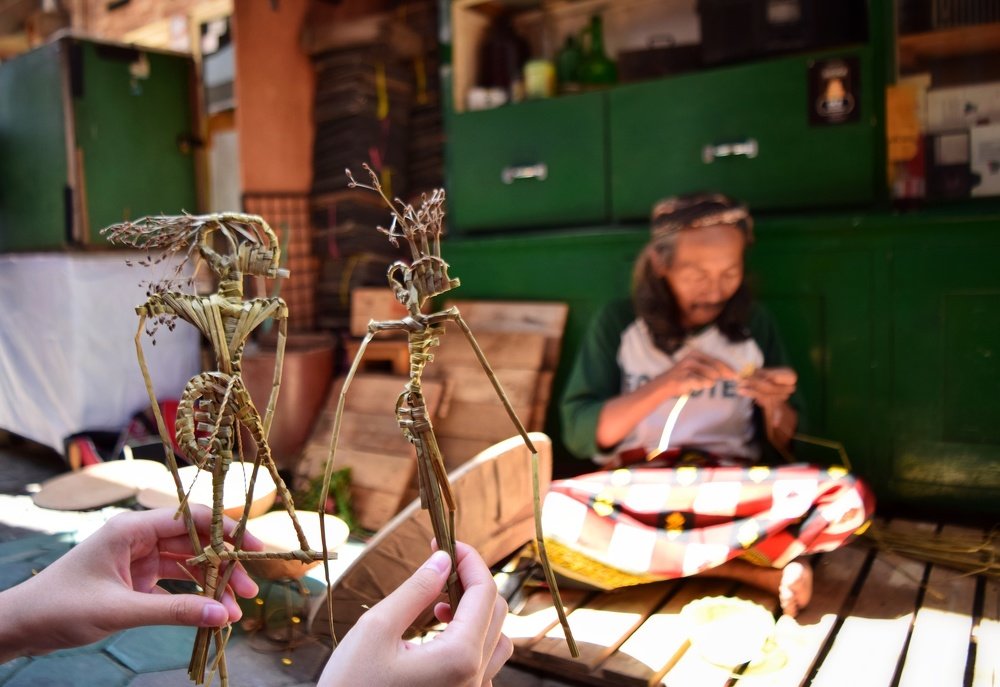 A traditional handmade wayang artist and his works