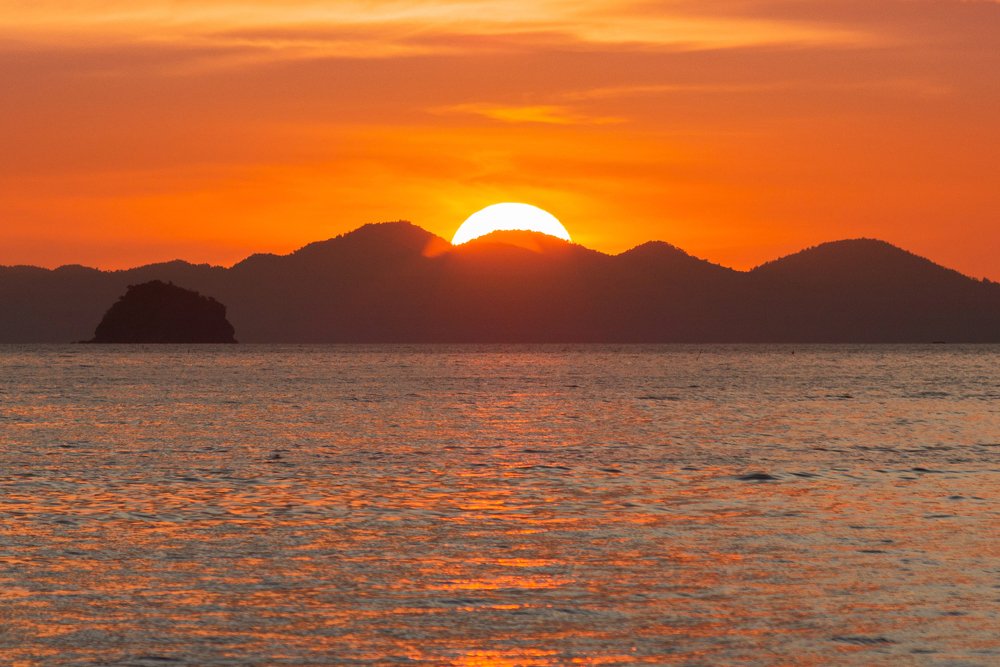 Sunset over the mountains and the sea