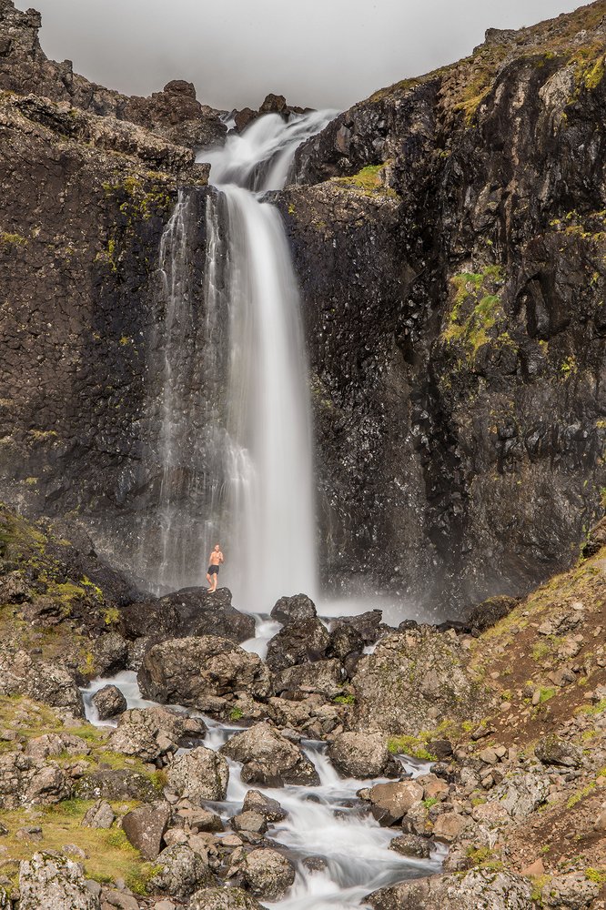 Shower under waterfall
