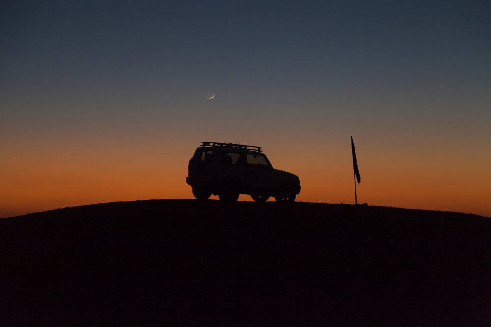 sunset in the middle of desert