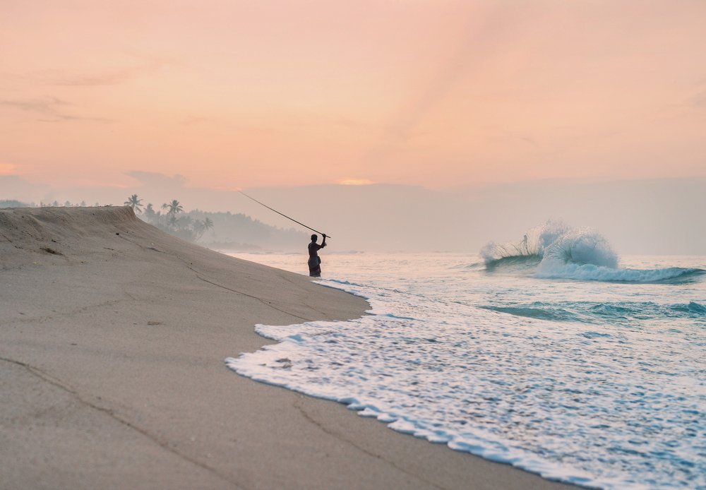 Fishermen on the sunset