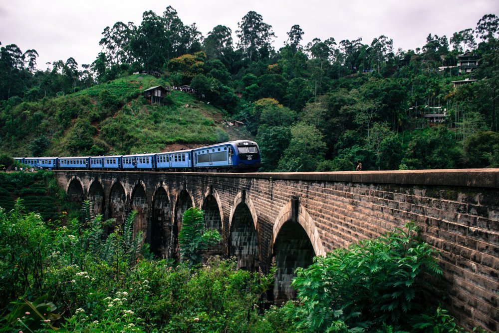 Train on 9 arch bridge