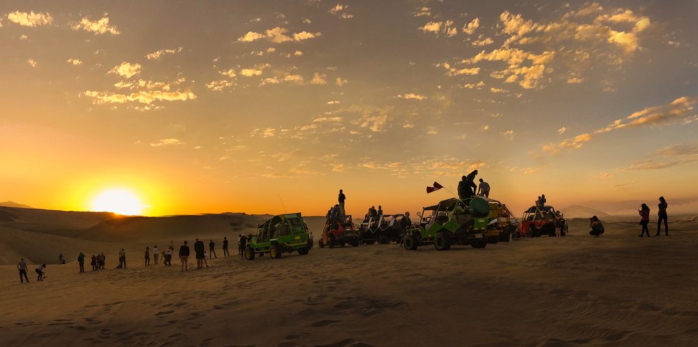 dune buggies at sunset