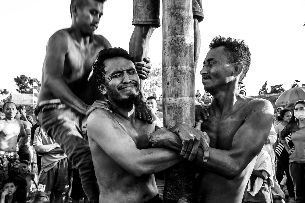 climbing slippery pole