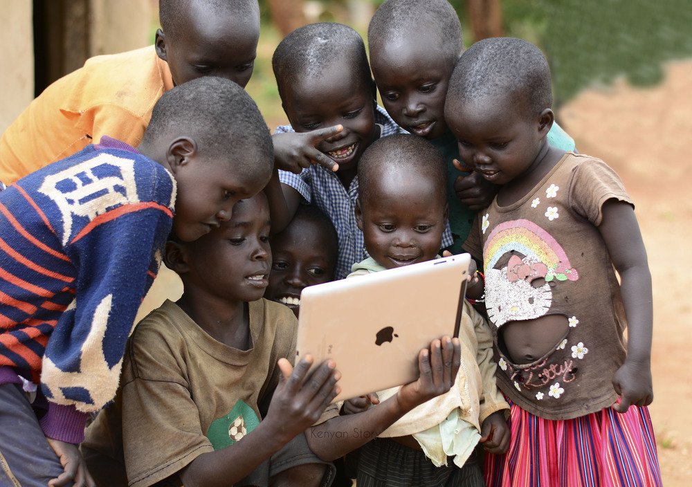 Kids playing with a tablet