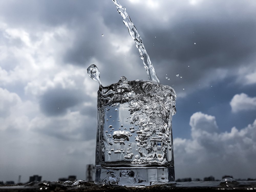 Water dropping in a glass