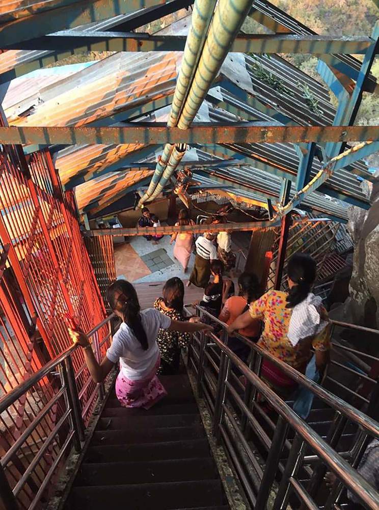 Walking down the stairs in a Buddhist temple in Myanmar