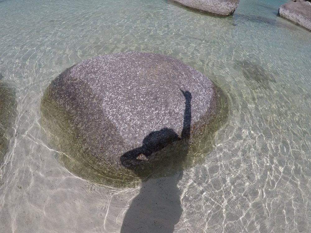 Girl´s shadow at the sea