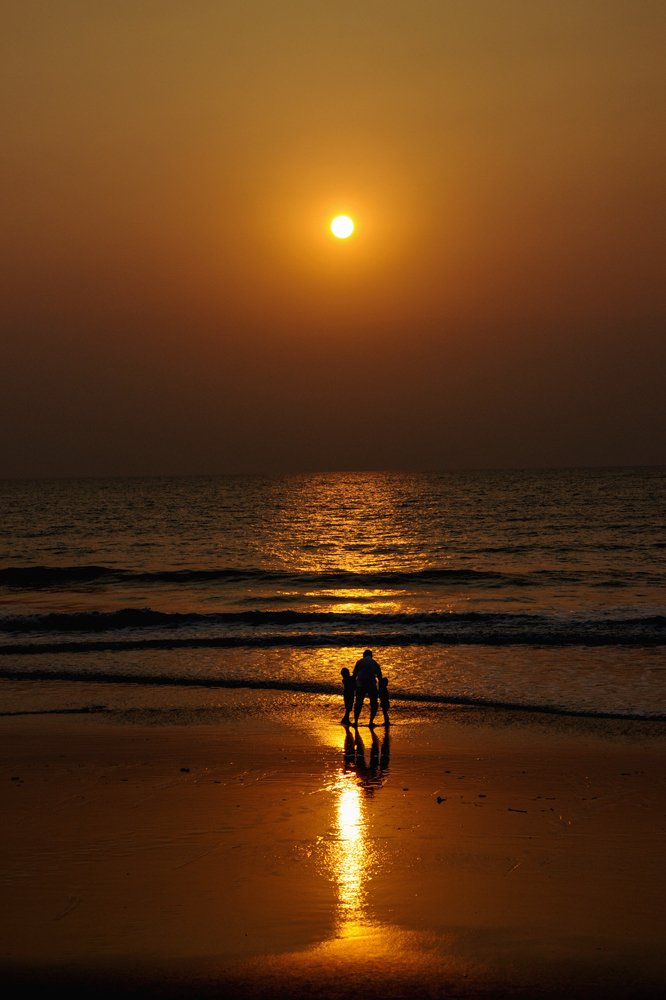 Sunset walk on the beach with Daddy.