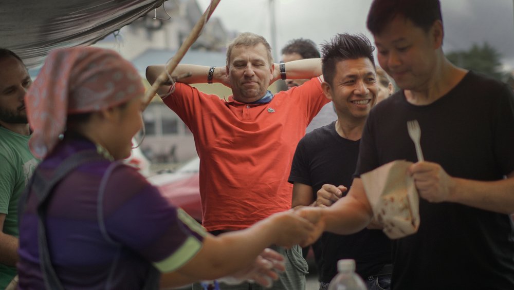 Trying new food, malaysian market.