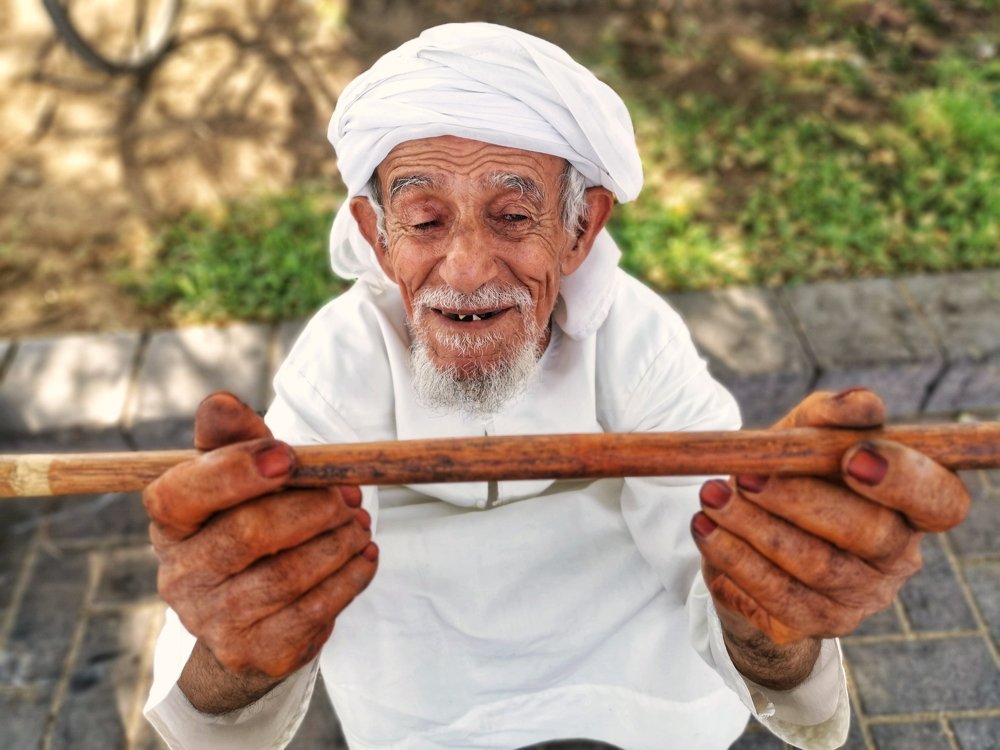 Old Man with the Wooden Stick
