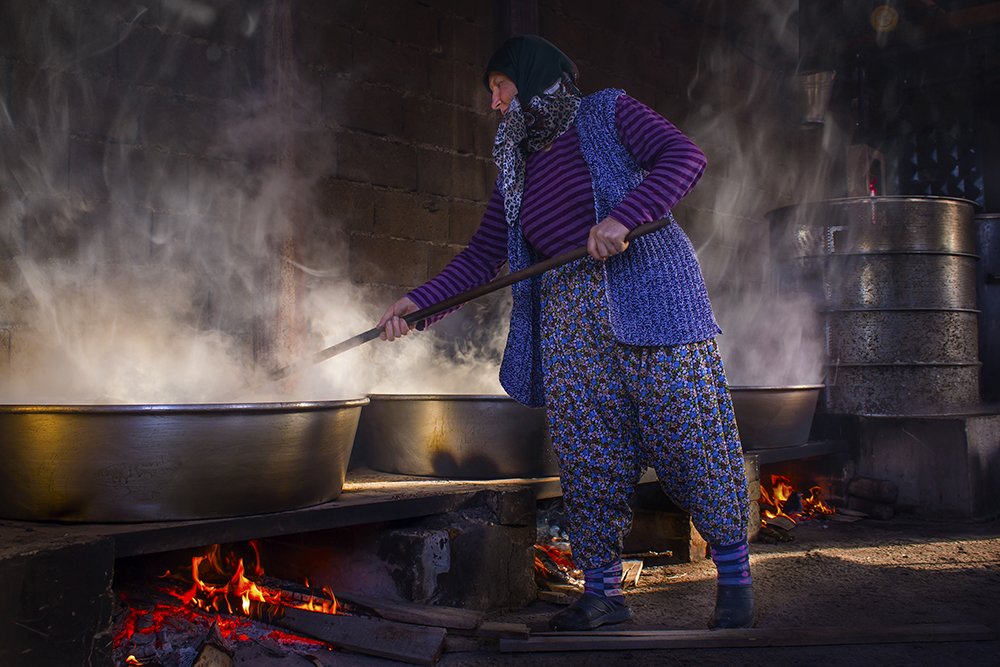 Woman making molasses