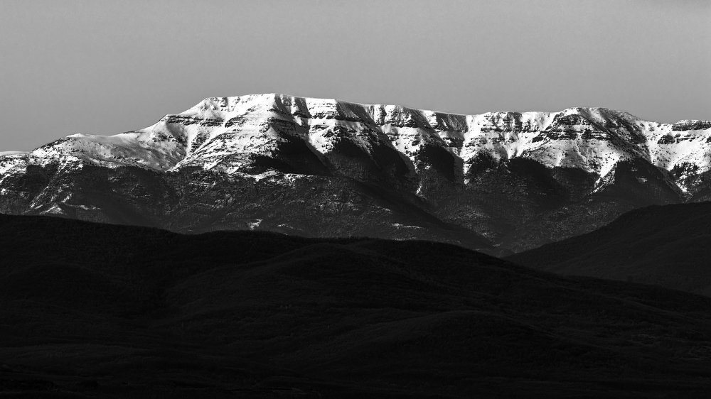 Black and White mountain tops covered with snow