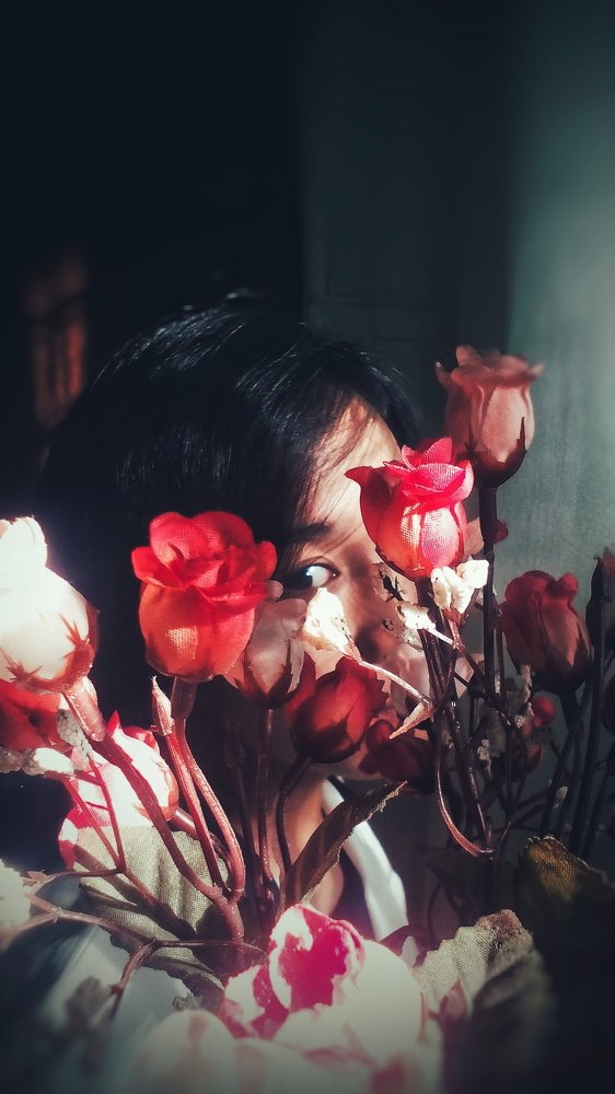 Sad Eyes behind Happy Roses