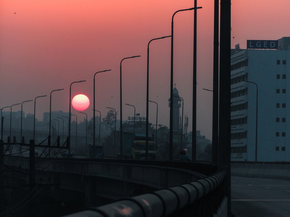 SUN IS SETTING ON A BUSY CITY