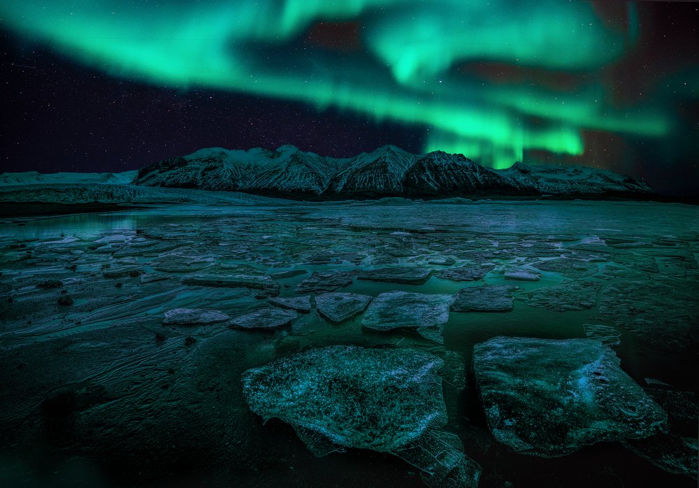 Northern lights illuminate the glacier