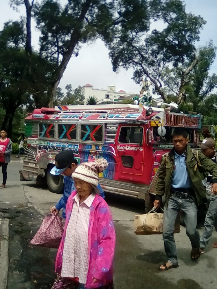 Suburban Ibaloi Tribesmen Arriving at the City